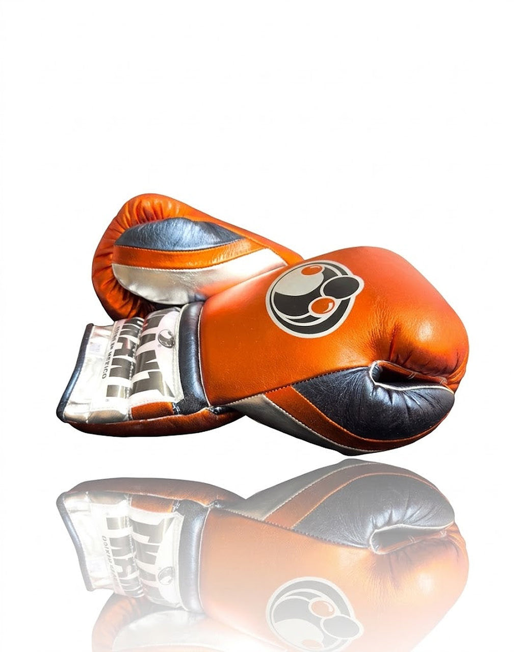 Grant metallic orange lace-up boxing gloves with silver cuff band and black laces on the palm side - side view