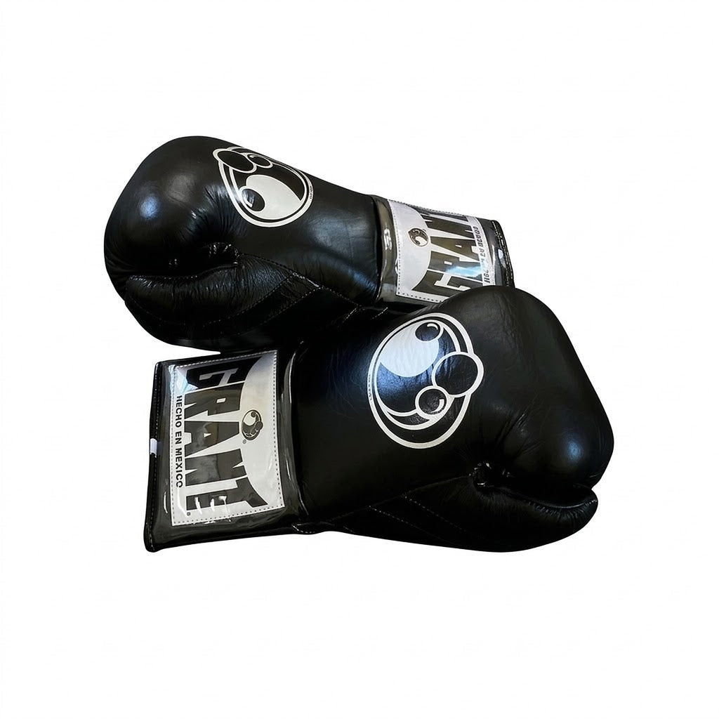 Grant full black lace-up boxing gloves with black laces and white logo on the cuff patch - close-up of logo and cuff