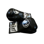 Grant full black lace-up boxing gloves with black laces and white logo on the cuff patch - close-up of logo and cuff
