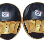Pair of Winning black curved focus mitts with gold palm and gold rim around the striking face - palm side