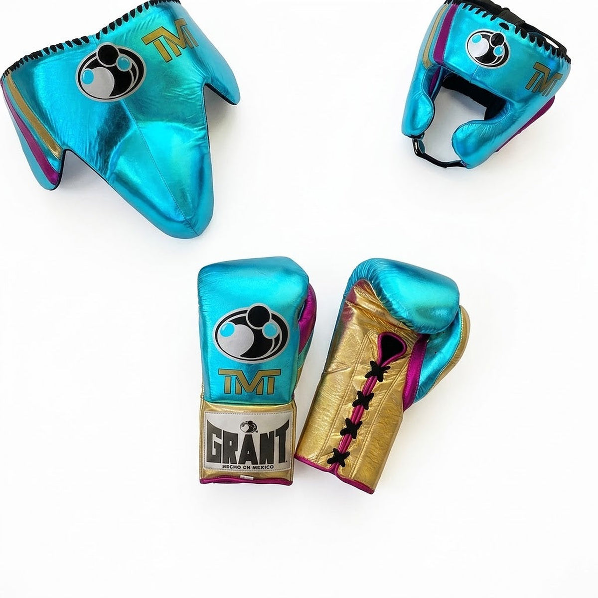 Grant metallic turquoise lace-up gloves with gold palms, matching headgear and groin guard with purple trim