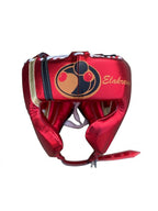 Grant metallic red lace-up boxing gloves, headgear and groin guard finished with gold trim along the edges - side view