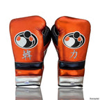 Grant metallic orange lace-up boxing gloves with silver cuffs alongside matching orange headgear - alternate angle