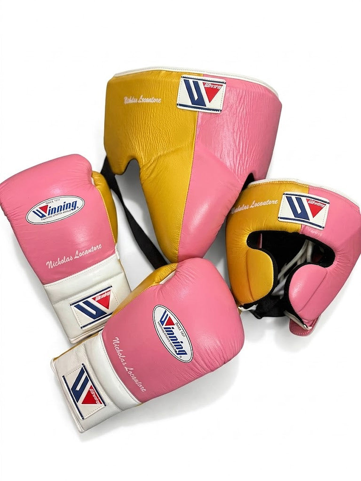 Winning boxing set with pink and white lace-up gloves, gold headgear and gold groin guard - palm and closure detail