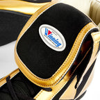 Side profile of the Winning RS-003 showing gold leather panels and oval Winning collar patch