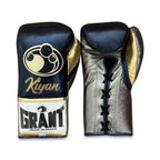 Grant navy lace-up boxing gloves with silver palms, shown with matching navy headgear and groin guard - side view