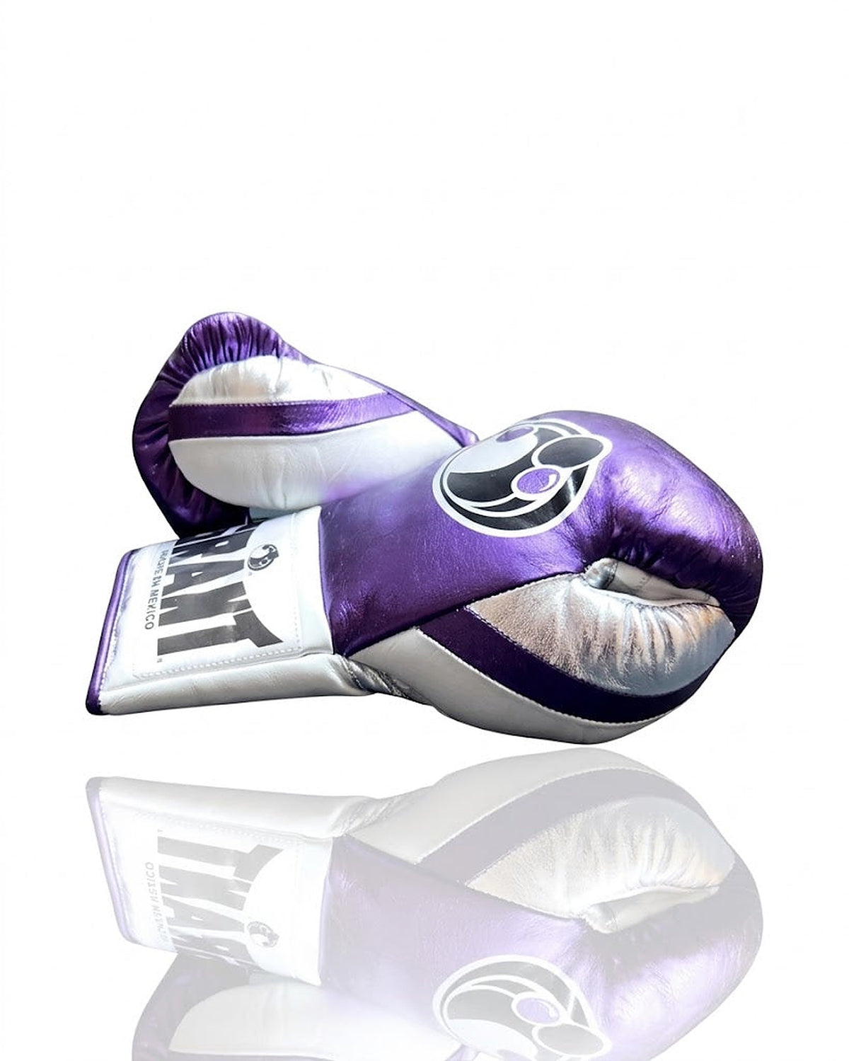 Grant boxing gloves with a shiny metallic purple back, white palm and white laces down the palm - side view