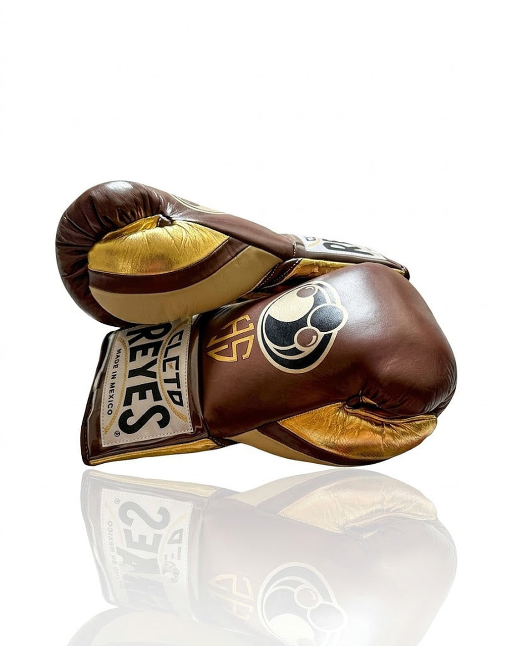 Grant brown boxing gloves with metallic gold palm and sample gold initials print on the back of the hand - side view