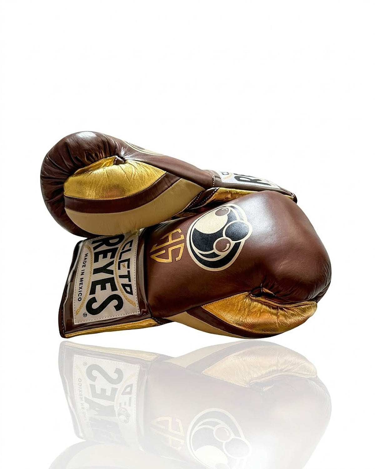Grant brown boxing gloves with metallic gold palm and sample gold initials print on the back of the hand - side view