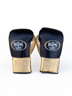 No Boxing No Life lace-up gloves, headgear and groin guard split in deep navy and champagne gold - palm and closure detail