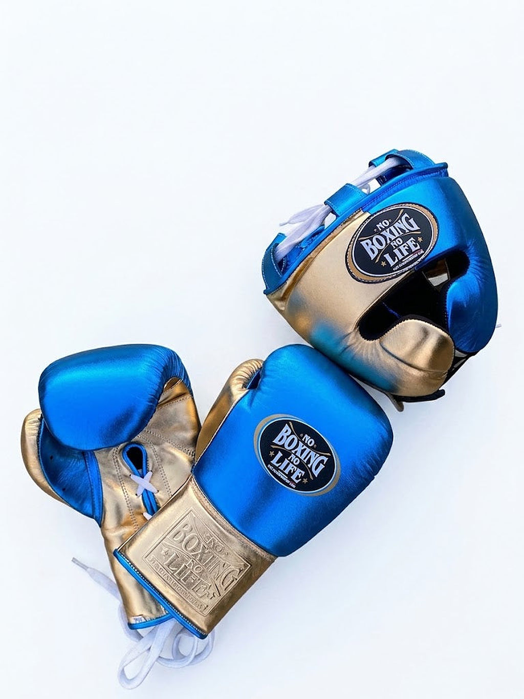 No Boxing No Life lace-up gloves, headgear and groin guard split in metallic royal blue and gold - close-up of logo and cuff