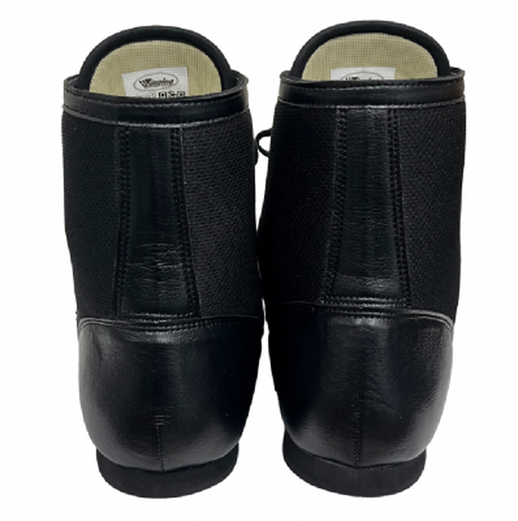 Close-up of the black leather and mesh upper of the Winning RS-100 with small white logo