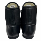 Close-up of the black leather and mesh upper of the Winning RS-100 with small white logo