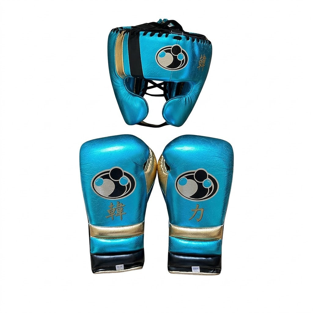 Grant metallic sky blue lace-up boxing gloves and matching headgear with gold accents and round Grant logo