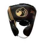 Grant brown lace-up boxing gloves with gold palms beside matching brown headgear and brown groin guard - alternate angle