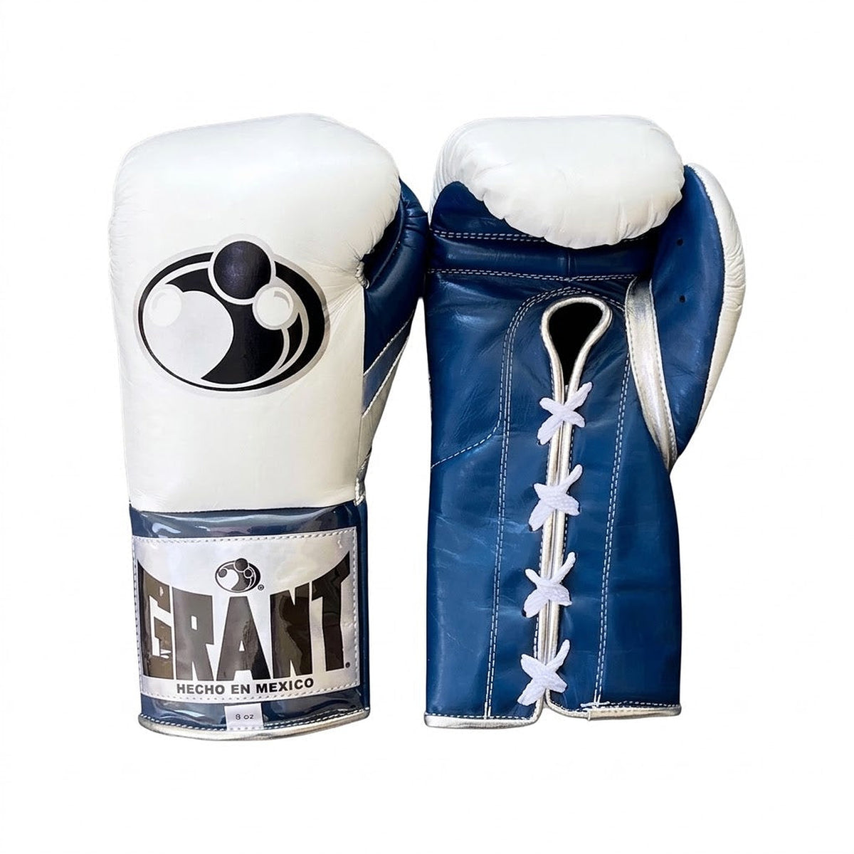 Grant boxing gloves with white back, navy blue palm and white laces, shown in lace-up fight style
