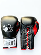Grant all-black lace-up boxing gloves with red laces down the palm and red inner lining visible - side view