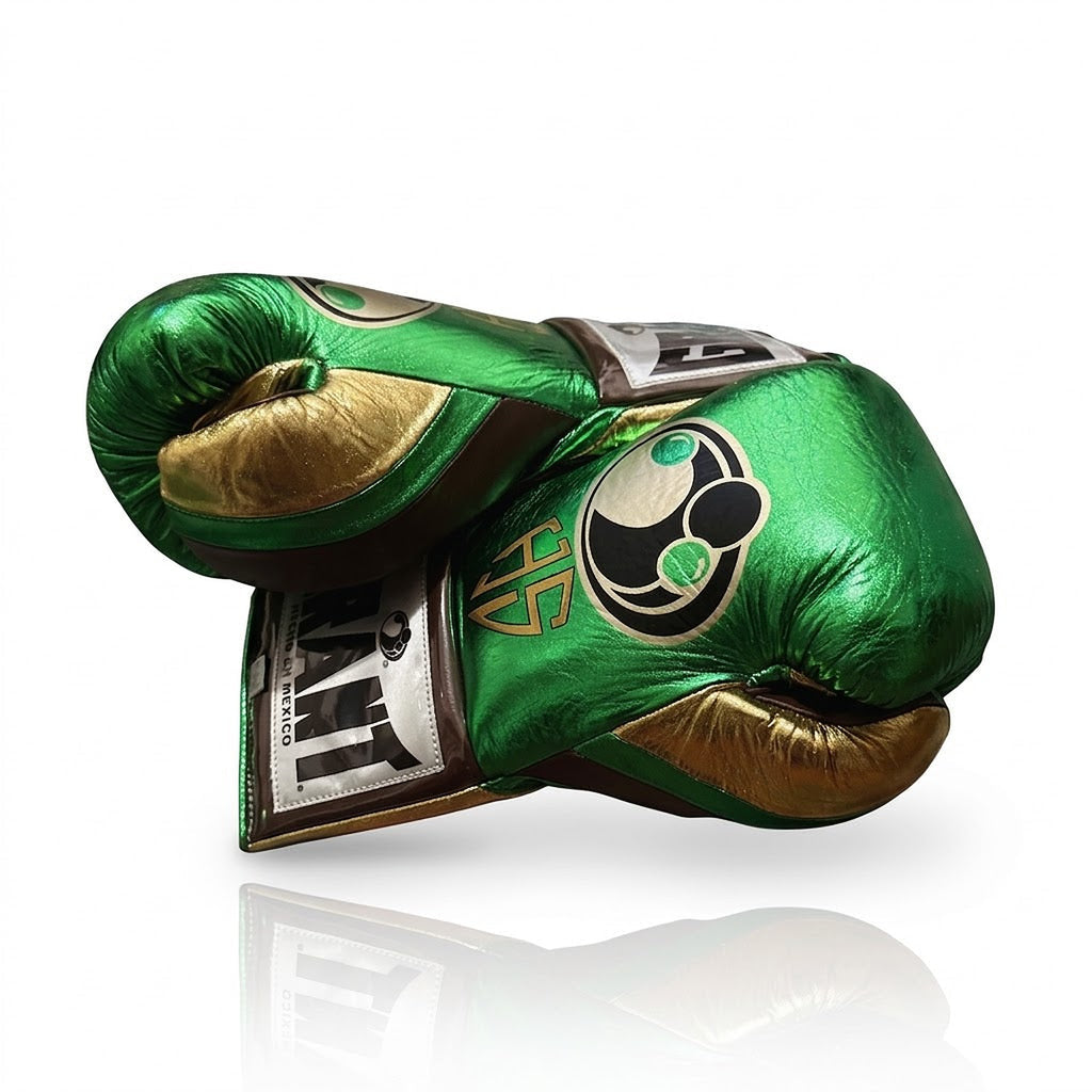 Grant metallic green lace-up boxing gloves with gold palms, plus green headgear and groin guard - close-up of logo and cuff