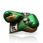 Grant metallic green lace-up boxing gloves with gold palms, plus green headgear and groin guard - close-up of logo and cuff