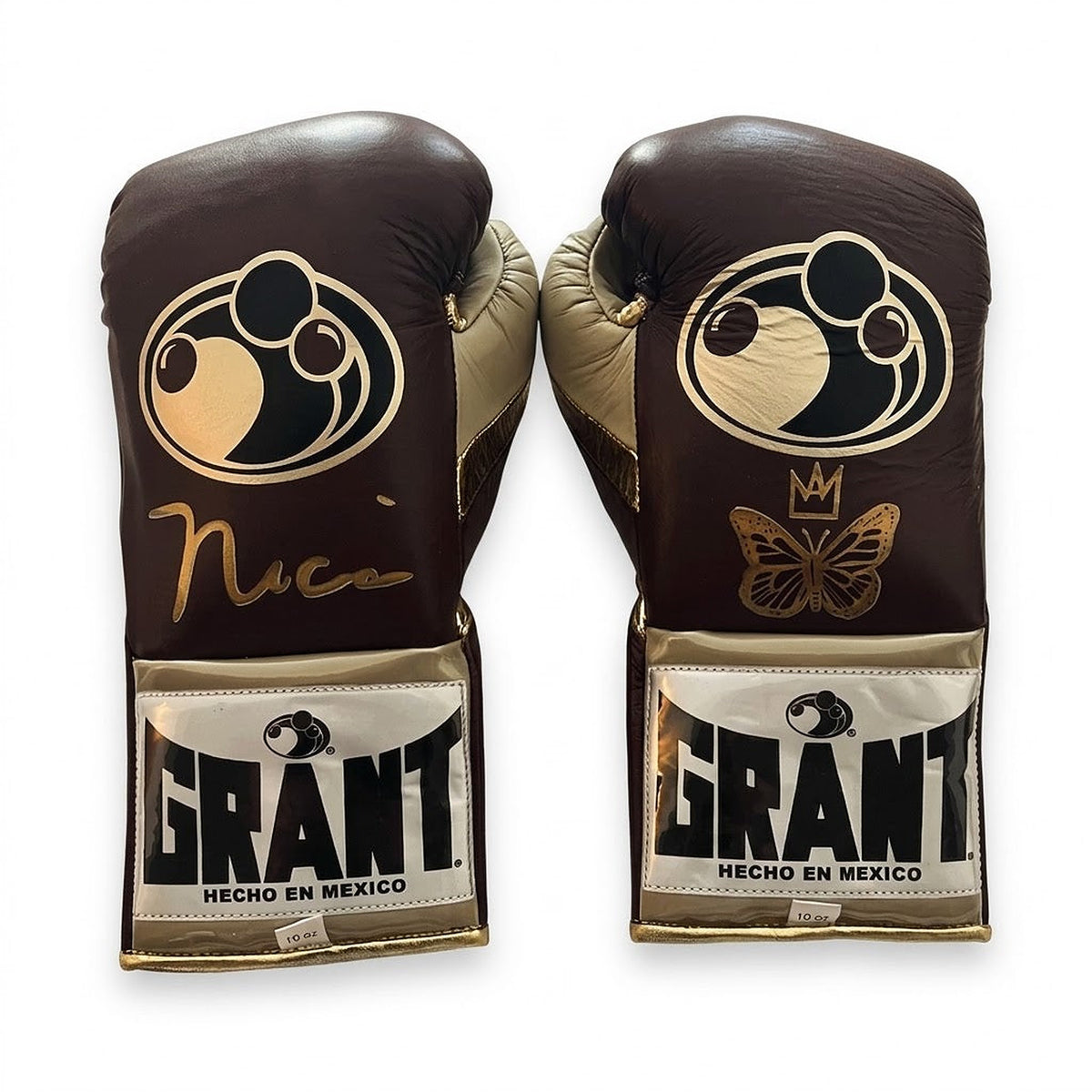 Grant brown lace-up boxing gloves with gold palms beside brown headgear and brown groin guard - palm and closure detail