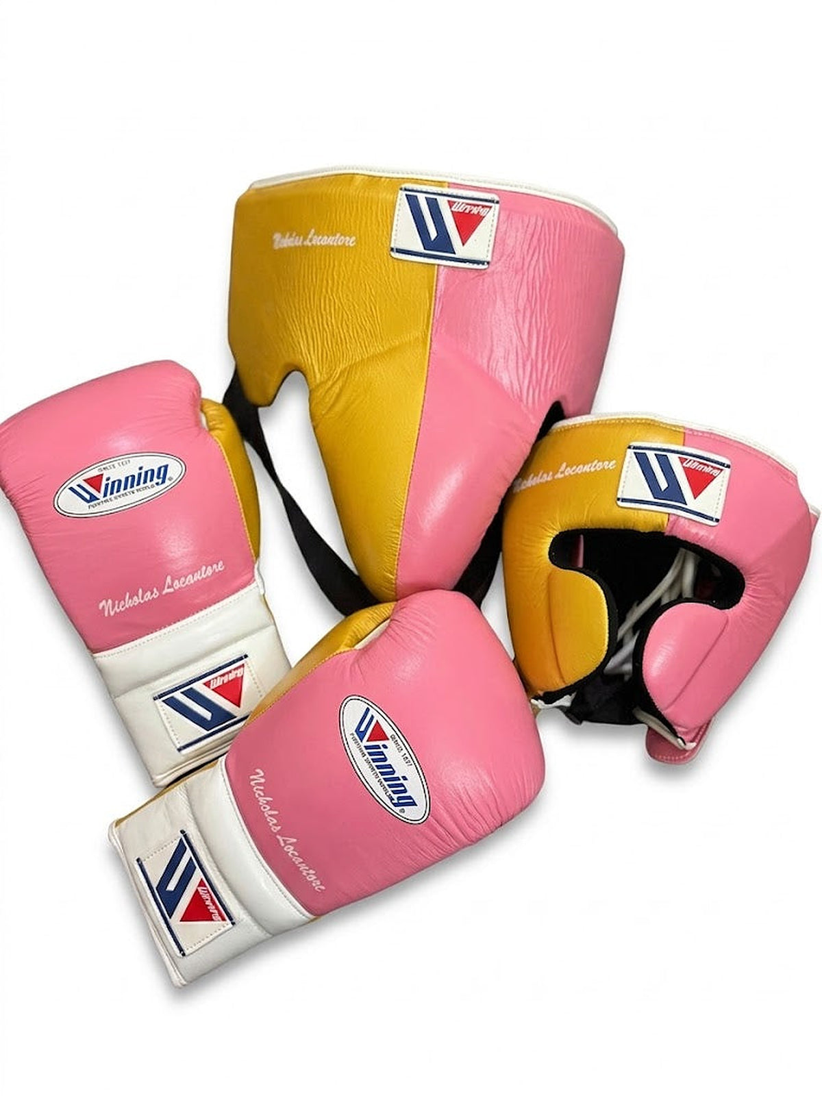 Winning boxing set with pink and white lace-up gloves, gold headgear and gold groin guard