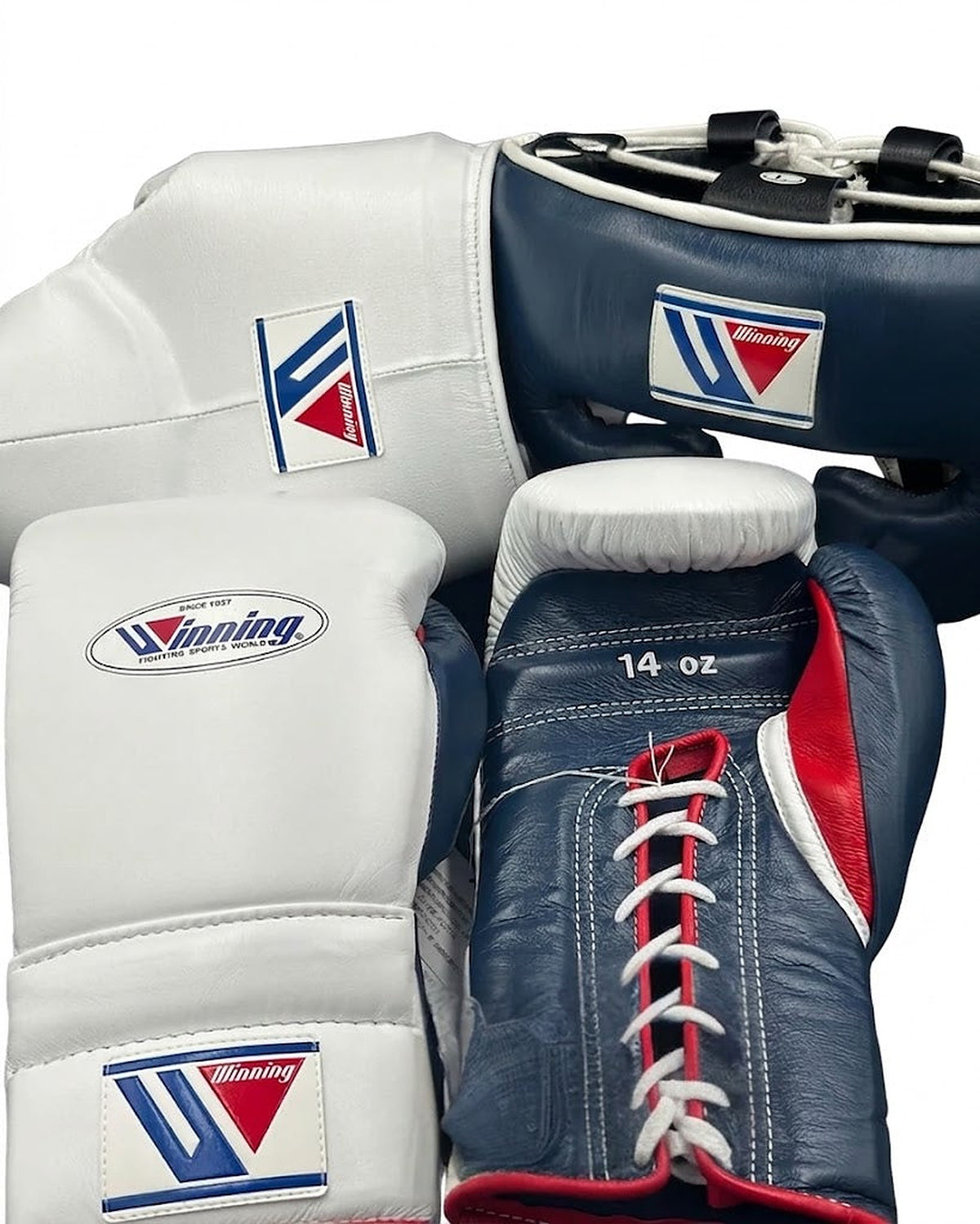 Winning white and navy boxing set with red accents, lace-up gloves, headgear and groin guard