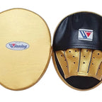 Pair of Winning black curved focus mitts with gold palm and gold rim around the striking face - alternate angle