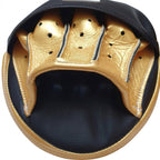 Pair of Winning black curved focus mitts with gold palm and gold rim around the striking face - close-up of the gold rim