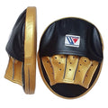 Pair of Winning black curved focus mitts with gold palm and gold rim around the striking face