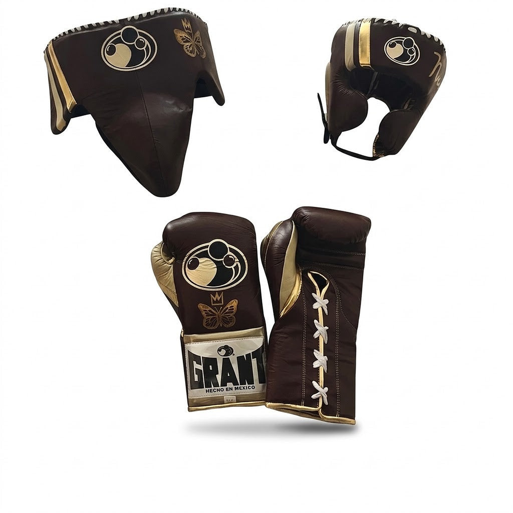 Grant brown lace-up boxing gloves with gold palms beside matching brown headgear and brown groin guard