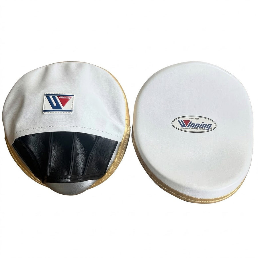 Winning white curved focus mitts with gold rim around the striking face and black palm, as a pair