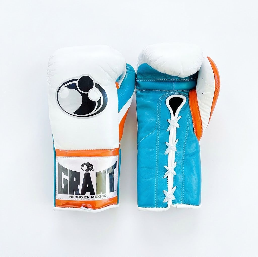 Grant boxing gloves with a white back, bright turquoise palm and orange piping around the cuff