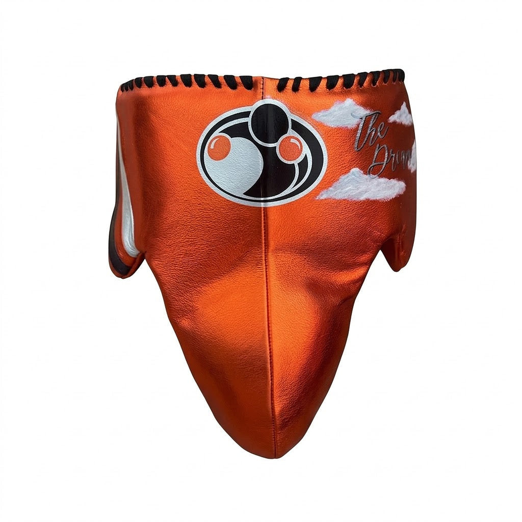 Grant metallic orange lace-up gloves with silver GRANT cuff patch, matching orange headgear and groin guard - alternate angle