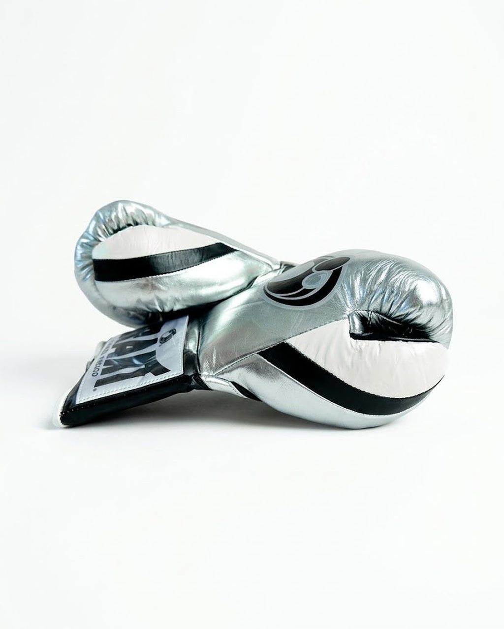 Grant boxing gloves with chrome silver back, black palm and white laces in two-tone lace-up style - side view
