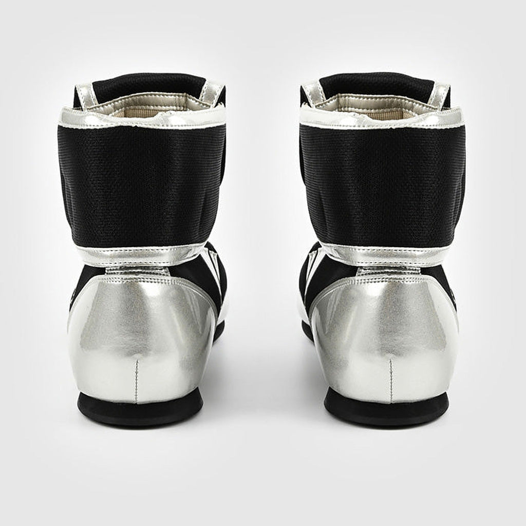 Winning RS-100 boxing shoe side view with silver-white lower panel beneath the black mesh