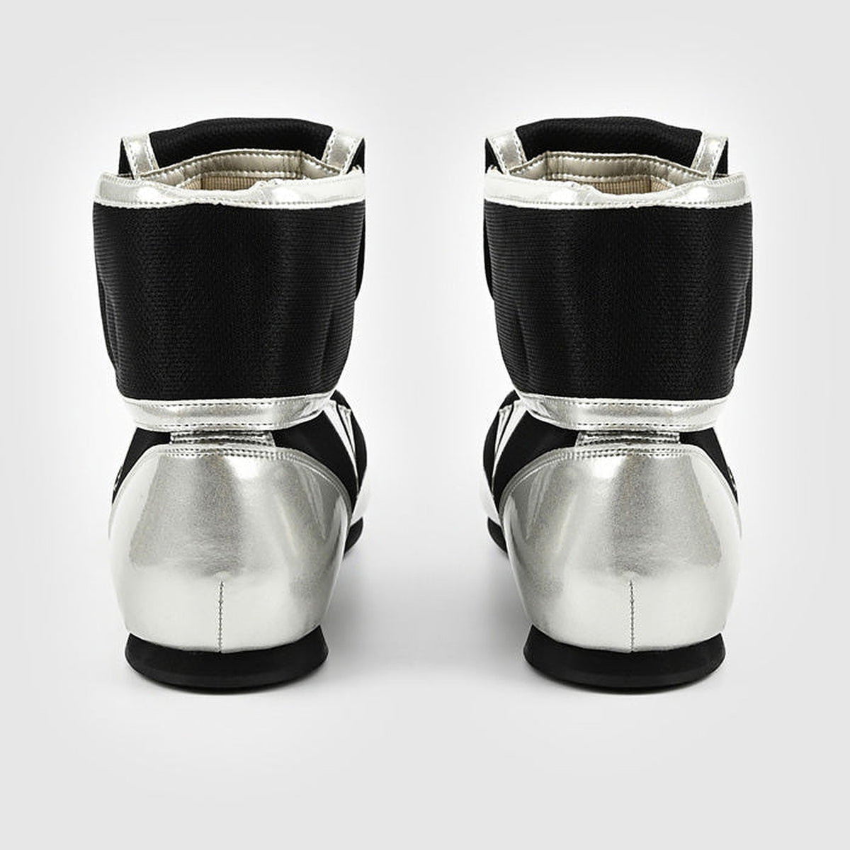Winning RS-100 boxing shoe side view with silver-white lower panel beneath the black mesh