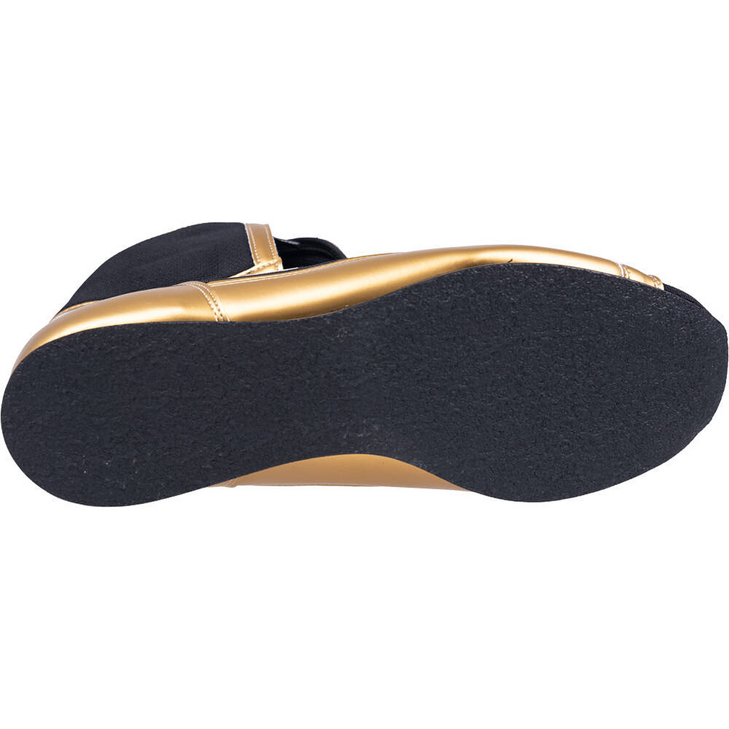 Underside of the Winning FOLD Type boxing shoe showing the black sole below the gold upper
