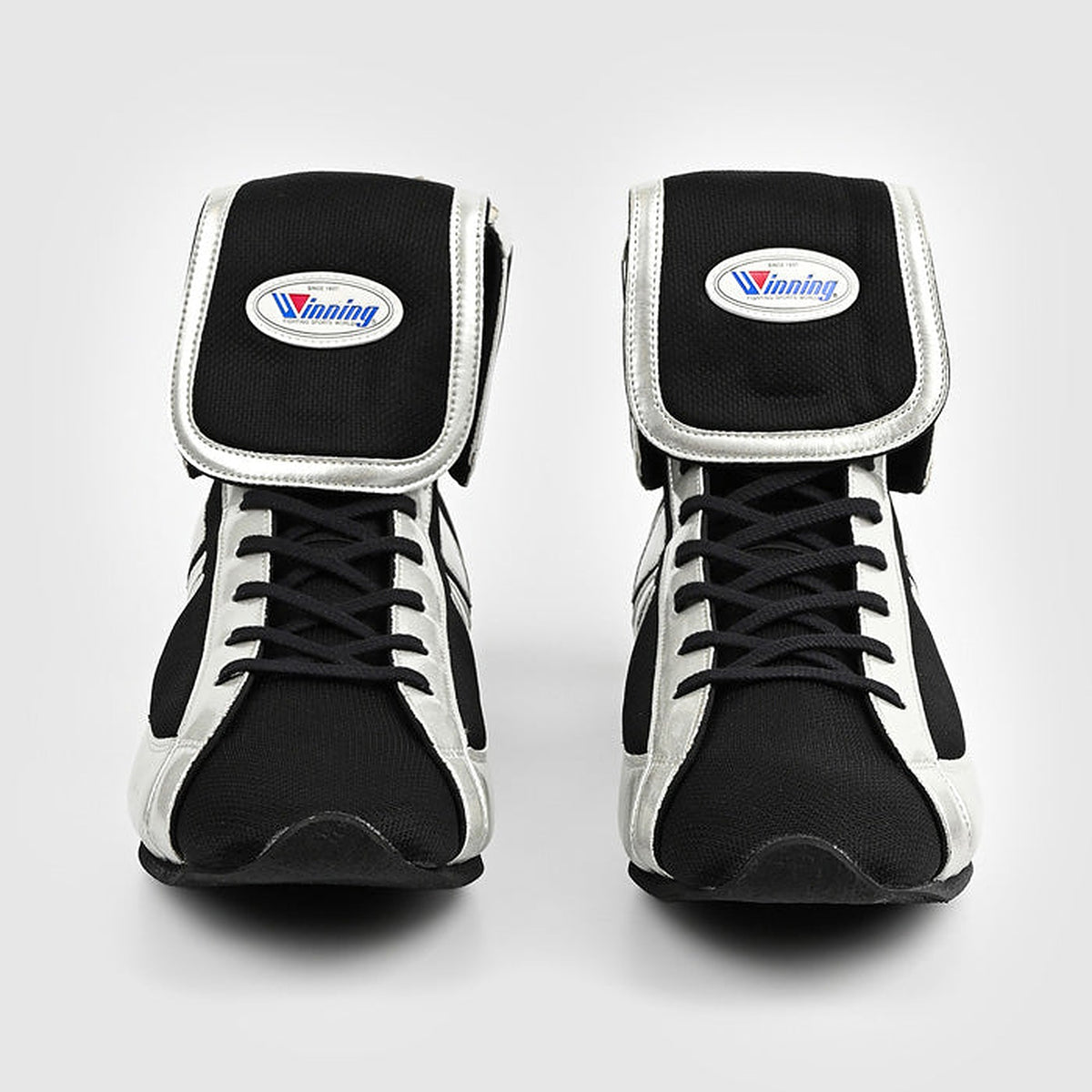 Winning RS-100 black and white boxing shoe showing the black fold-over collar and oval patch
