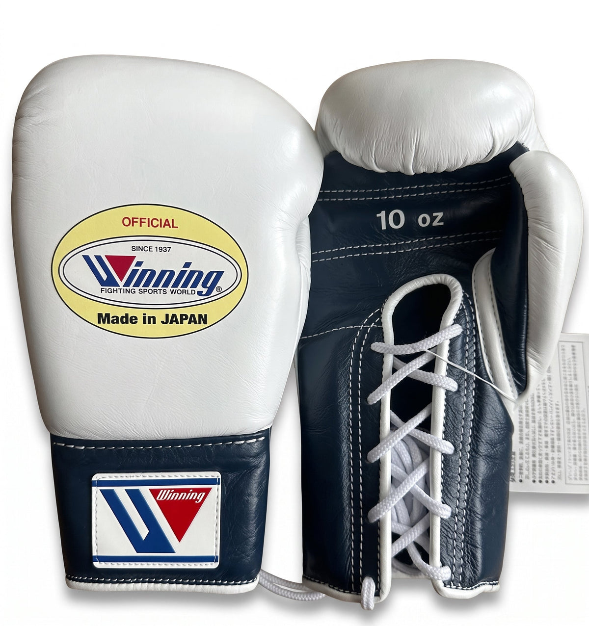 Winning white boxing gloves with a navy palm and navy cuff, laced up with W logo