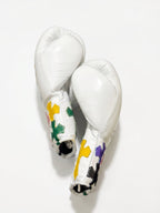 Winning white boxing gloves with multicolor cross patches on the cuff and a sample script name print - palm and closure