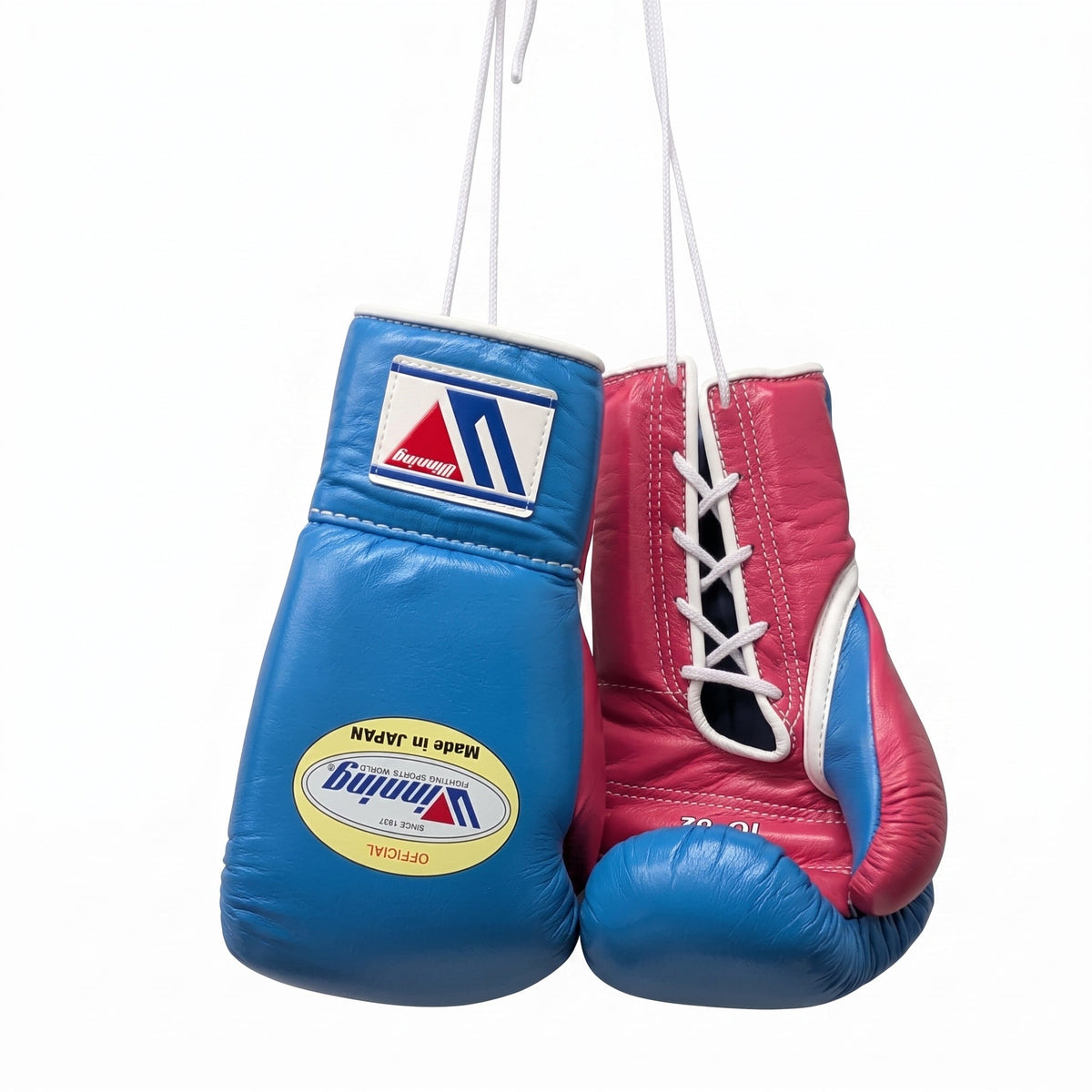 Winning royal blue boxing gloves with red palm, shown hanging by their laces