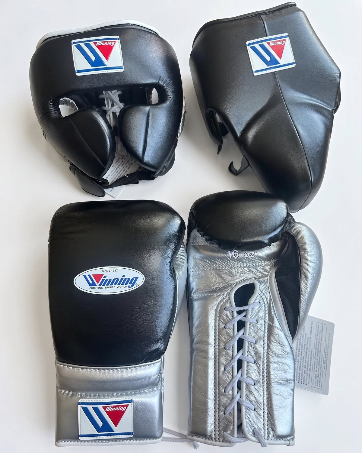 Winning black boxing set with silver palm lace-up gloves, headgear and groin guard showing W triangle logo
