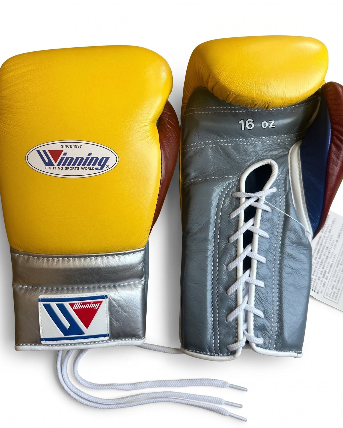 Winning yellow boxing gloves with steel gray palm and silver cuff, lace-up closure