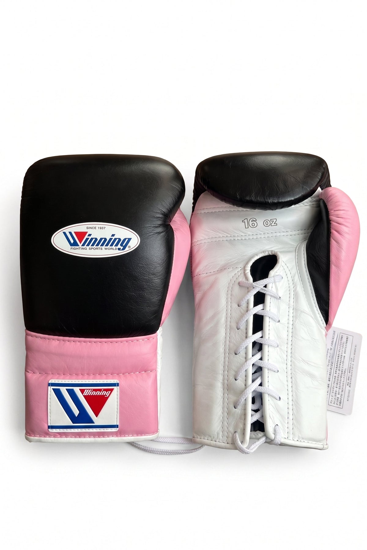 Winning black boxing gloves with a white palm and bright pink cuff, laced at the wrist