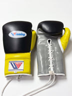 Winning black boxing gloves with gray palm and bright yellow cuff, laced up at the wrist - alternate angle
