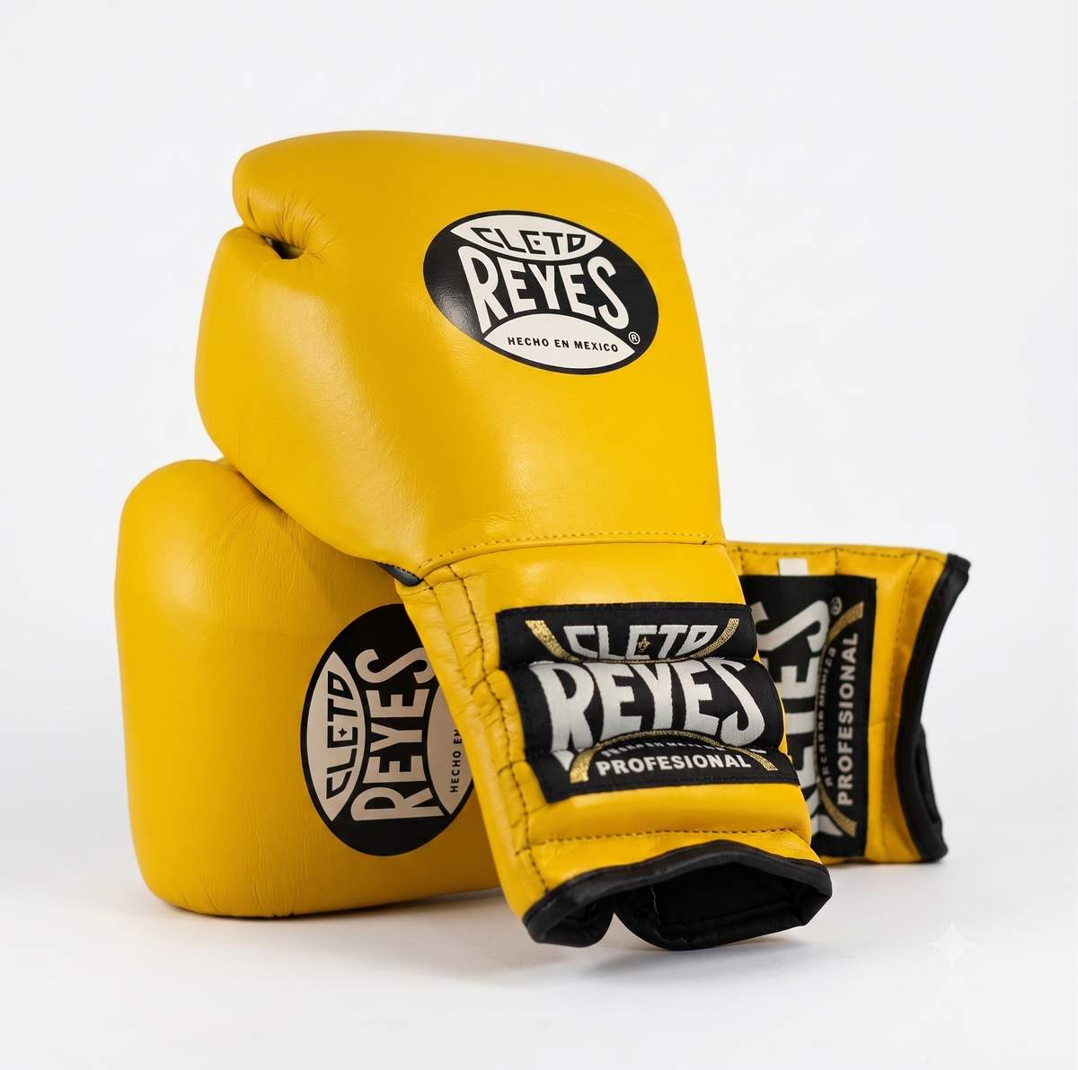 Three Cleto Reyes yellow boxing gloves stacked showing brand logo on knuckle and wrist