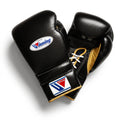Winning MS-600 lace-up boxing glove in black leather with gold laces and gold inner cuff accents