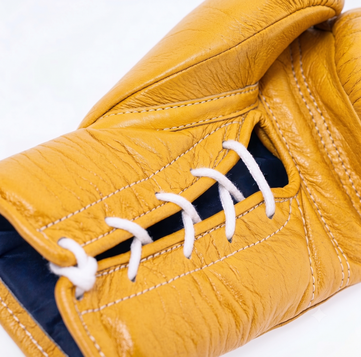 Winning lace-up boxing glove in full bright yellow leather with matching laces and the W triangle logo - side view