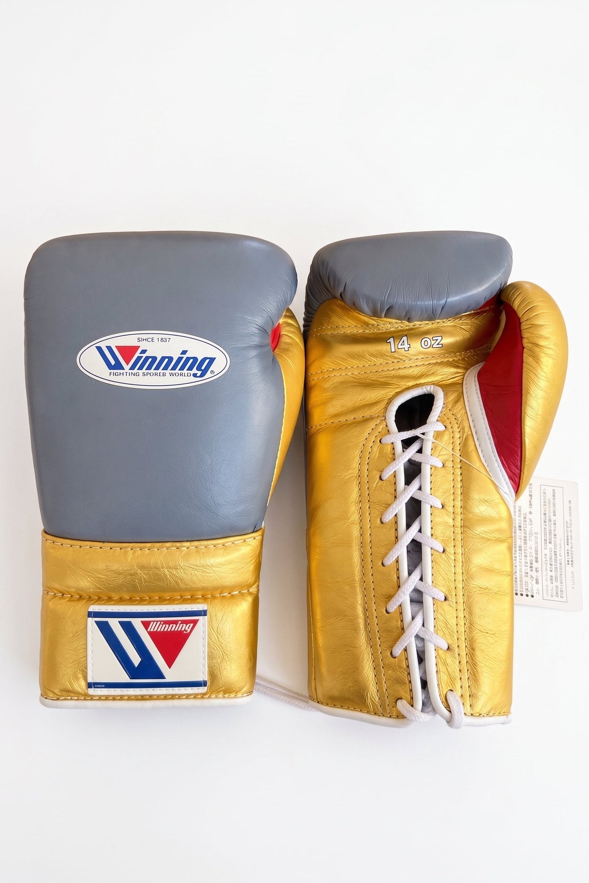 Winning gray boxing gloves with metallic gold palm and red inner lining, lace-up wrist