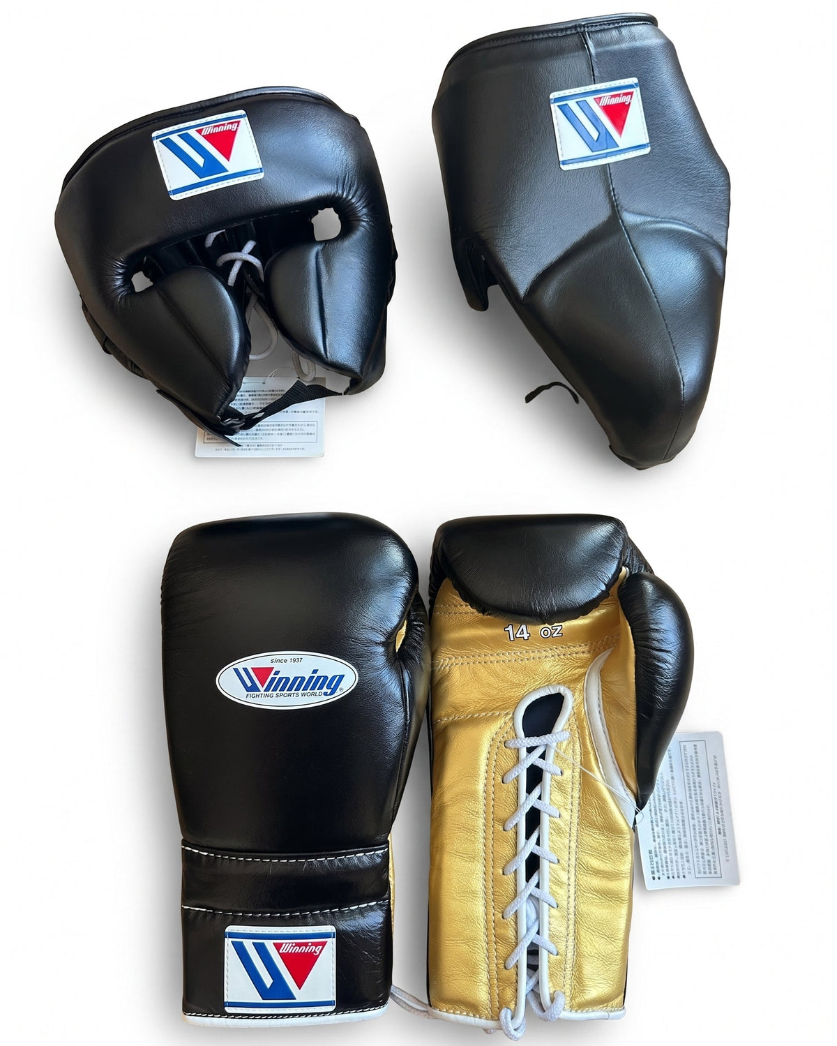 Winning black boxing set with metallic gold palm lace-up gloves, black headgear and groin guard